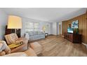 Bright living room featuring hardwood floors and comfy seating at 334 Skylark Nw Ln, Port Charlotte, FL 33952