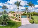 Charming single-Gathering home with a well-maintained lawn, lush landscaping, and a two-car garage at 3507 Marsala Ct, Punta Gorda, FL 33950