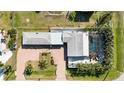 Single-story home with pool and tropical landscaping, seen from above at 351 S Mccall Rd, Englewood, FL 34223