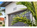 Modern two-car garage with dark gray doors and updated hardware at 3800 Carupano Ct, Punta Gorda, FL 33950