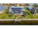 Backyard oasis with heated pool, solar panels, and private dock at 529 Belvedere Ct, Punta Gorda, FL 33950