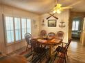 Charming dining area with wooden table and coastal decor at 6501 Center Ln, North Port, FL 34287