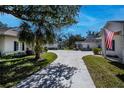 Well-maintained community with similar homes and landscaping at 1407 Red Oak Ln, Port Charlotte, FL 33948