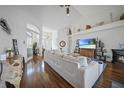 Spacious living area with hardwood floors, large sectional sofa, and fireplace at 1412 Sea Fan Dr, Punta Gorda, FL 33950