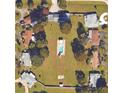 Aerial view of residential neighborhood showing several homes each with a swimming pool at 181 Coconut St, Punta Gorda, FL 33980