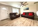 Spacious living room with large windows and a comfortable seating area at 28301 N Twin Lakes Dr, Punta Gorda, FL 33955