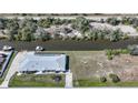 An aerial view of a charming home with a private pool and canal access, perfect for boating enthusiasts at 3339 Desoto Dr, Punta Gorda, FL 33983