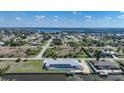 Scenic aerial view of the property in a waterfront community with access to a serene bay at 3339 Desoto Dr, Punta Gorda, FL 33983