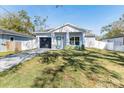 Newly built craftsman home with driveway and lawn at 706 W Madison St, Plant City, FL 33563