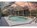 Relaxing screened-in pool area perfect for entertaining guests or Gathering fun at 9 Logan St, Port Charlotte, FL 33954