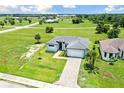 One-story house, paver driveway, and spacious green lawn at 16506 Cape Horn Blvd, Punta Gorda, FL 33955