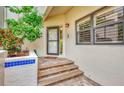 Inviting front entrance with brick steps and manicured landscaping at 1710 Starling Dr # 102, Sarasota, FL 34231