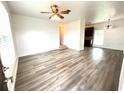 Bright living room with hardwood floors and access to other rooms at 21157 Midway Blvd, Port Charlotte, FL 33952