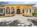 Elegant front entrance with a double door and columns at 21370 Harborside Blvd, Port Charlotte, FL 33952