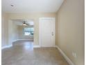 Bright entryway with neutral paint, tile flooring, and an open view to the living area at 21402 Meehan Ave, Port Charlotte, FL 33952