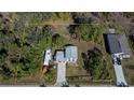 Aerial view showing house, RV, and surrounding land at 28094 Chinquapin Dr, Punta Gorda, FL 33955