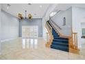 Bright and airy living room with high ceilings and elegant staircase at 298 Fry Se Ter, Port Charlotte, FL 33952