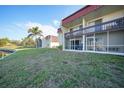 Condo building exterior with waterfront views and green space at 311 Garvin St # 207B, Punta Gorda, FL 33950