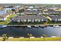 Aerial view of condo building, boat docks, and canal at 4000 Bal Harbor Blvd # 225, Punta Gorda, FL 33950