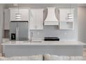 Modern kitchen with stainless steel appliances, island and marble countertops at 13364 Rayburn Ln, Port Charlotte, FL 33981