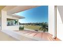 Scenic balcony view overlooking lush landscape with copper roofing on the structure below at 1340 Rock Dove Ct # 143, Punta Gorda, FL 33950