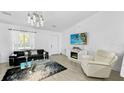 Bright living room featuring modern decor and a sleek entertainment center at 2325 Hanford Ln, North Port, FL 34288