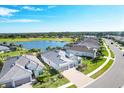 Community aerial view showcasing mature landscaping, golf course, and neighboring waterways at 25186 Keygrass Ct, Punta Gorda, FL 33955