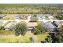 An overhead shot of the backyard and the community beyond the screened-in patio at 27199 Punta Cabello Ct, Punta Gorda, FL 33983