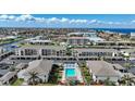Real estate including waterfront condos overlooking a community pool with lounge seating at 367 Coldeway Dr # H10, Punta Gorda, FL 33950