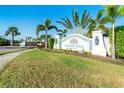 Entrance sign to the Poinciana Real Community, surrounded by lush landscaping at 6251 Cassia St, Bradenton, FL 34203
