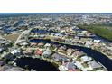 Aerial view of a waterfront community showcasing homes along canals, emphasizing the serene and luxurious lifestyle at 1259 Royal Tern Dr, Punta Gorda, FL 33950