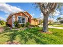 Lovely single-story home showcasing well-manicured landscaping and a cozy curb appeal at 1771 Scarlett Ave, North Port, FL 34289