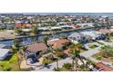 Waterfront neighborhood featuring single-Gathering homes, lush landscaping, and canal access at 2284 Palm Tree Dr, Punta Gorda, FL 33950