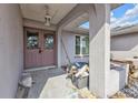 Front entrance with double doors and storm doors, columned supports, and porch at 26166 Paysandu Dr, Punta Gorda, FL 33983