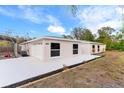 Attractive home with a paved driveway, a garage, and landscaping along the house at 9505 Delray Dr, New Port Richey, FL 34654