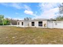 Well-maintained home featuring a fenced yard, showcasing curb appeal and outdoor space at 9505 Delray Dr, New Port Richey, FL 34654