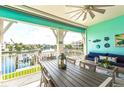 Charming outdoor patio with a serene water view, perfect for relaxation and entertaining guests at 11723 1St E St, Treasure Island, FL 33706