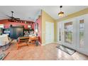 Inviting foyer with tile flooring and a decorative glass front door, leading into a spacious living area at 1200 Winward Ct, Punta Gorda, FL 33950