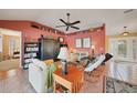 Cozy living room featuring stylish decor, a ceiling fan, and comfortable seating at 1200 Winward Ct, Punta Gorda, FL 33950