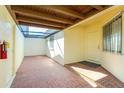 Inviting outdoor entrance area with brick floor, a translucent roof, and a secure front door at 1640 Atares Dr # 21, Punta Gorda, FL 33950