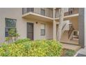 Entrance to condo featuring door and stairs at 1999 Kings Hwy # 21A, Punta Gorda, FL 33980