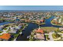 Aerial view of waterfront homes and canals offering boating and a picturesque coastal lifestyle at 237 Freeport Ct, Punta Gorda, FL 33950