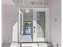 Grand entryway with double doors that lead into a spacious living area at 24344 Penhollow Ct, Punta Gorda, FL 33955