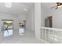 Bright living room with high ceilings, sleek tile floors, and great natural light at 24344 Penhollow Ct, Punta Gorda, FL 33955