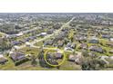 Aerial view of the community featuring lush landscaping and a serene residential setting at 25202 Chiclayo Ave, Punta Gorda, FL 33983