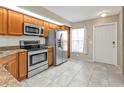 Bright kitchen with stainless steel appliances and ample cabinet space at 26300 Rampart Blvd # 404, Punta Gorda, FL 33983
