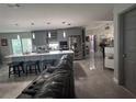 Open concept living area with a large kitchen island and stainless steel appliances at 3289 Pellam Blvd, Port Charlotte, FL 33948