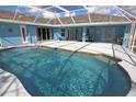 Sparkling in-ground pool surrounded by a screened enclosure, offering a private and relaxing outdoor space at 5131 Appomattox Dr, North Port, FL 34287