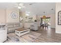 Open concept living and dining room with updated flooring, neutral walls, and natural lighting at 1909 Johannesberg Rd, North Port, FL 34288