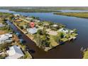 Aerial view of a lovely waterfront single-Gathering home situated on a canal neighborhood at 2012 River Basin Ter, Punta Gorda, FL 33982